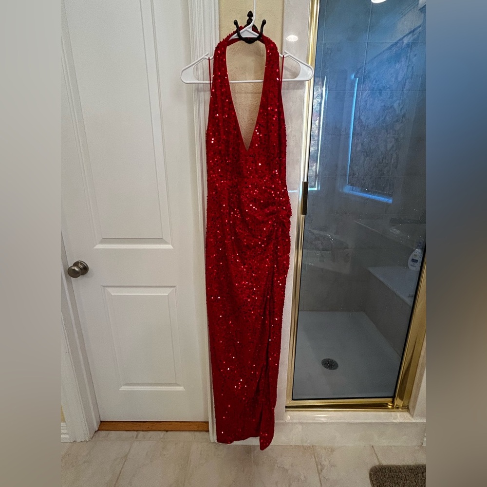 Women’s red sequin dress.